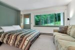 Living/sleeping area with queen murphy bed open